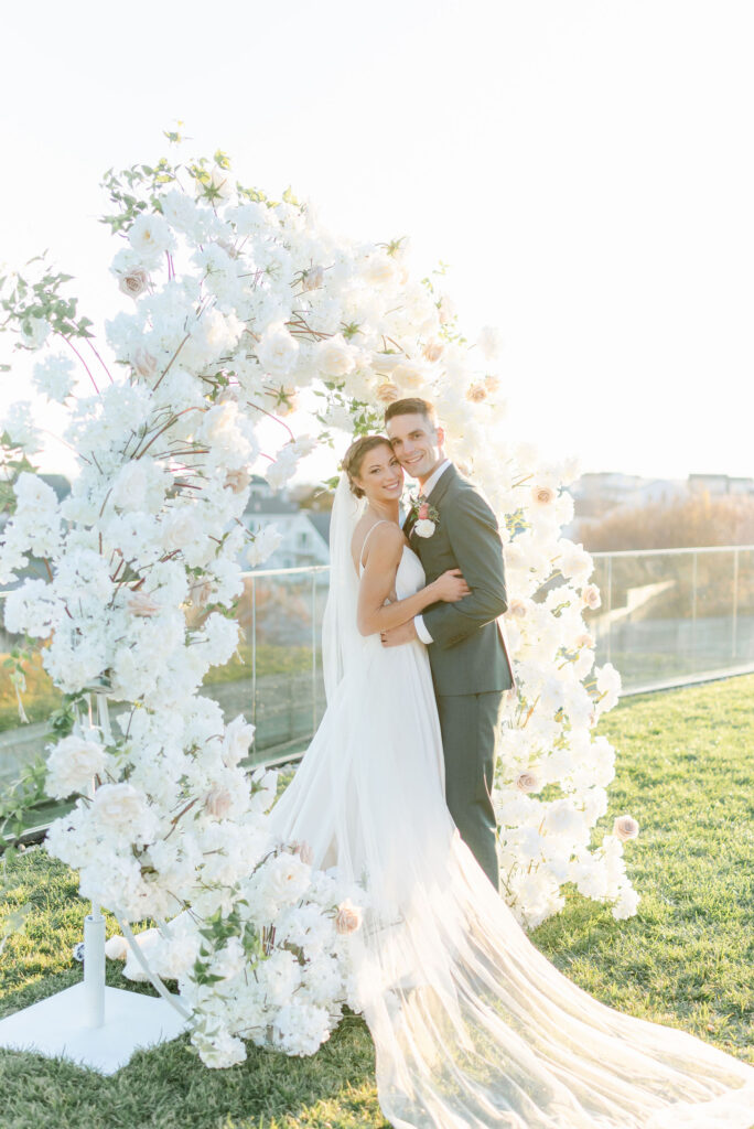 wedding couple bride and groom smiling golden hour portraits