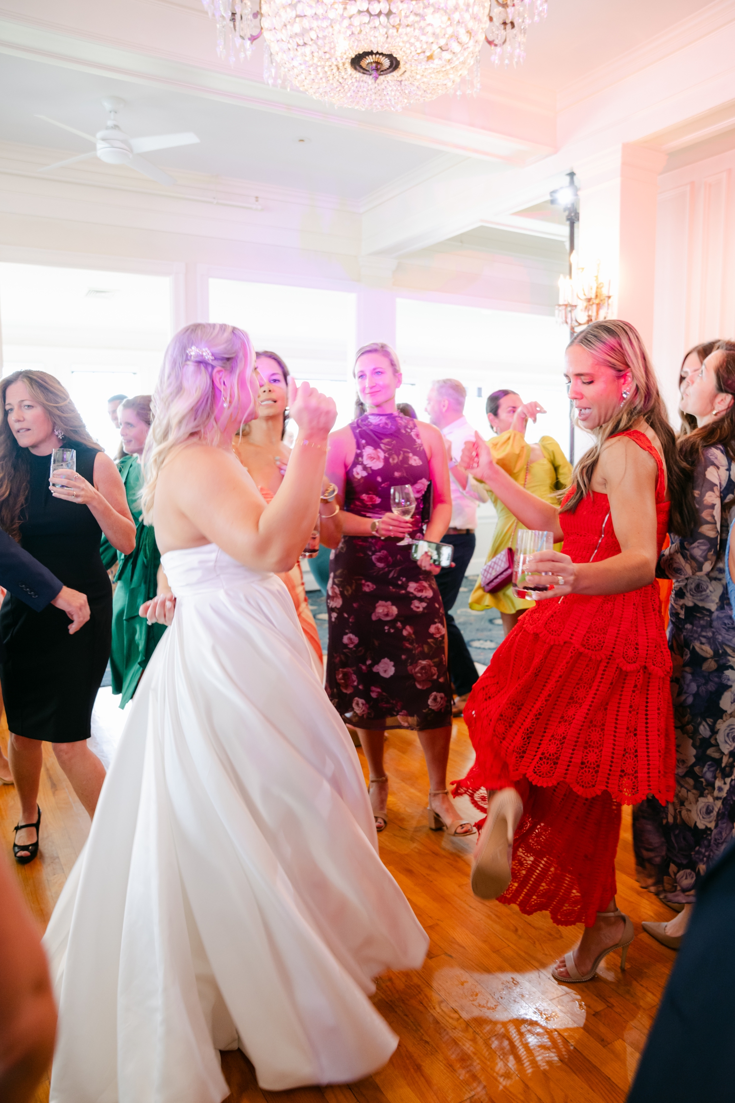 guests on a dance floor wearing bright red