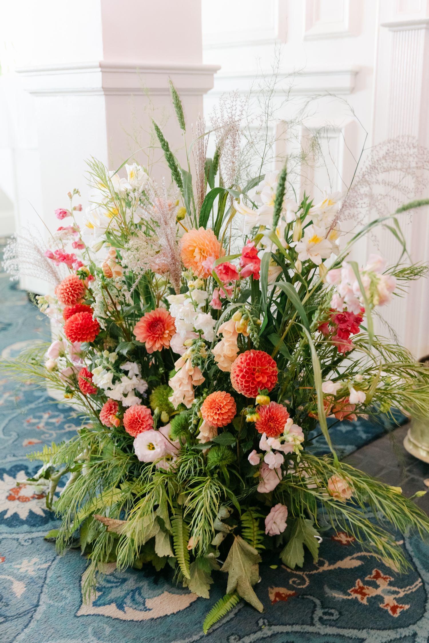 Chartreuse and red florals with hints of orange and yellow create a vibrant, joyful atmosphere for this colorful Maine wedding