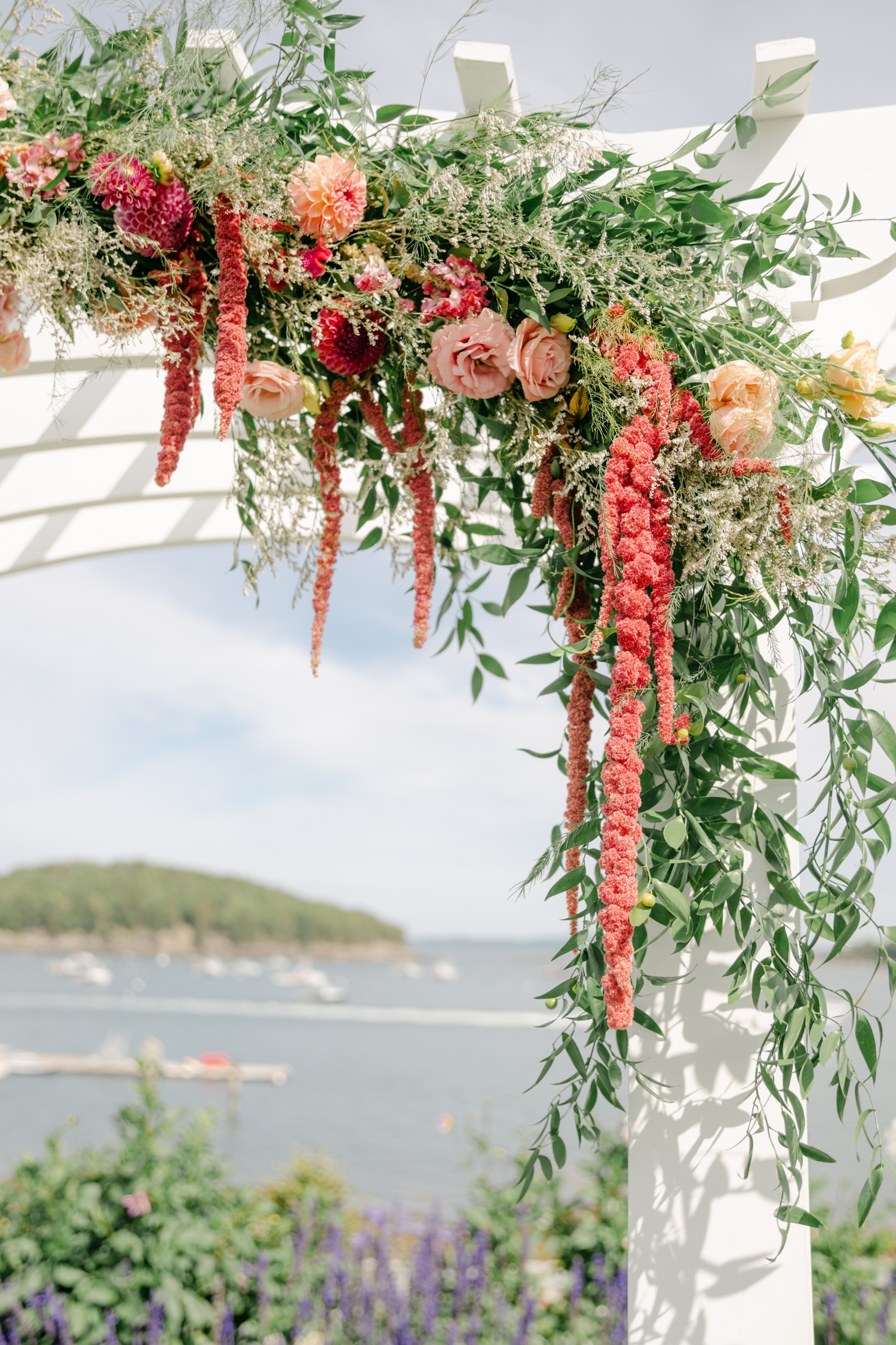 Vibrant citrus wedding florals in orange, pink, and chartreuse bringing joyful inspiration to a colorful coastal Maine celebration.