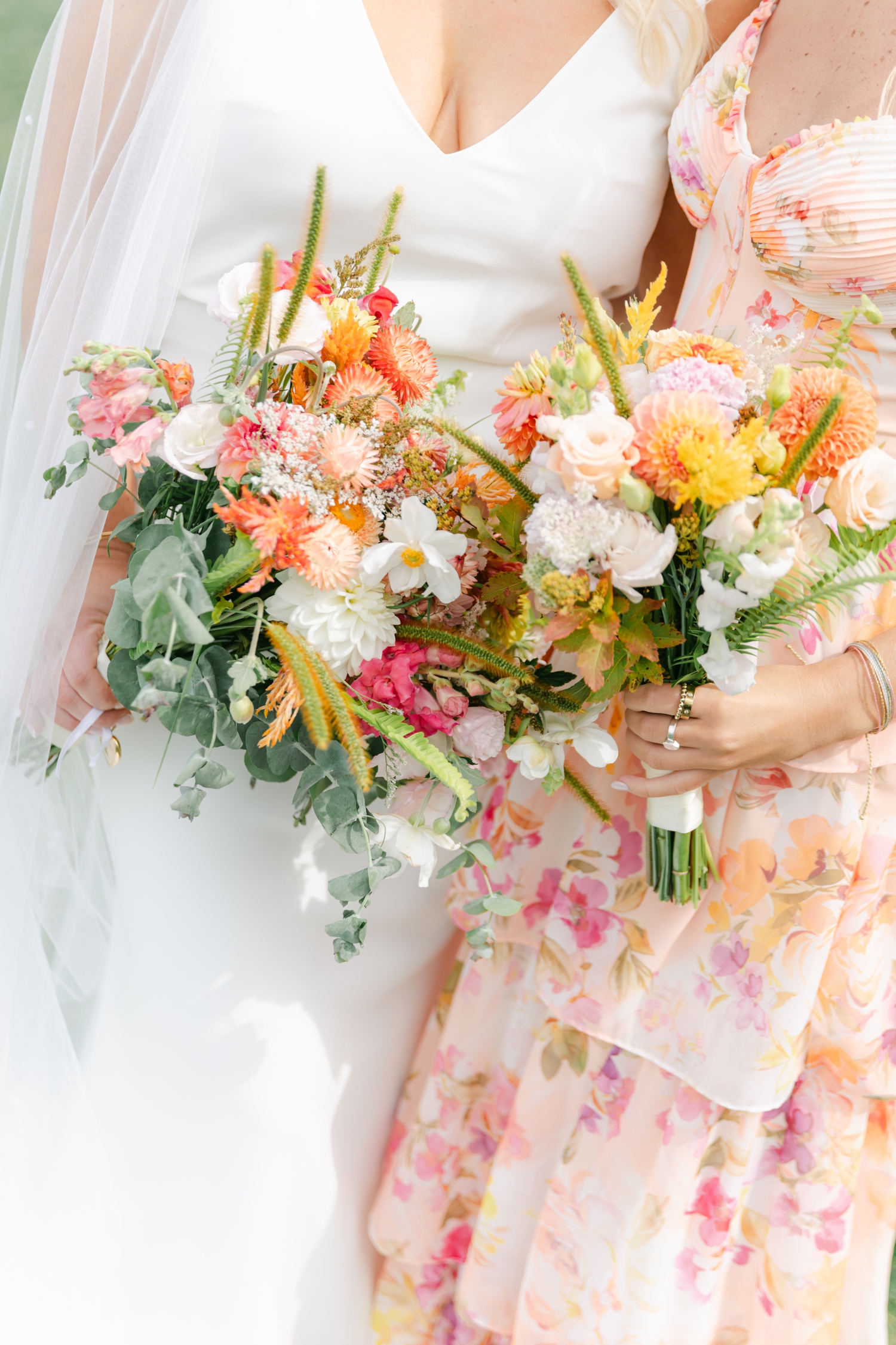 Vibrant citrus wedding florals in orange, pink, and chartreuse bringing joyful inspiration to a colorful coastal Maine celebration.
