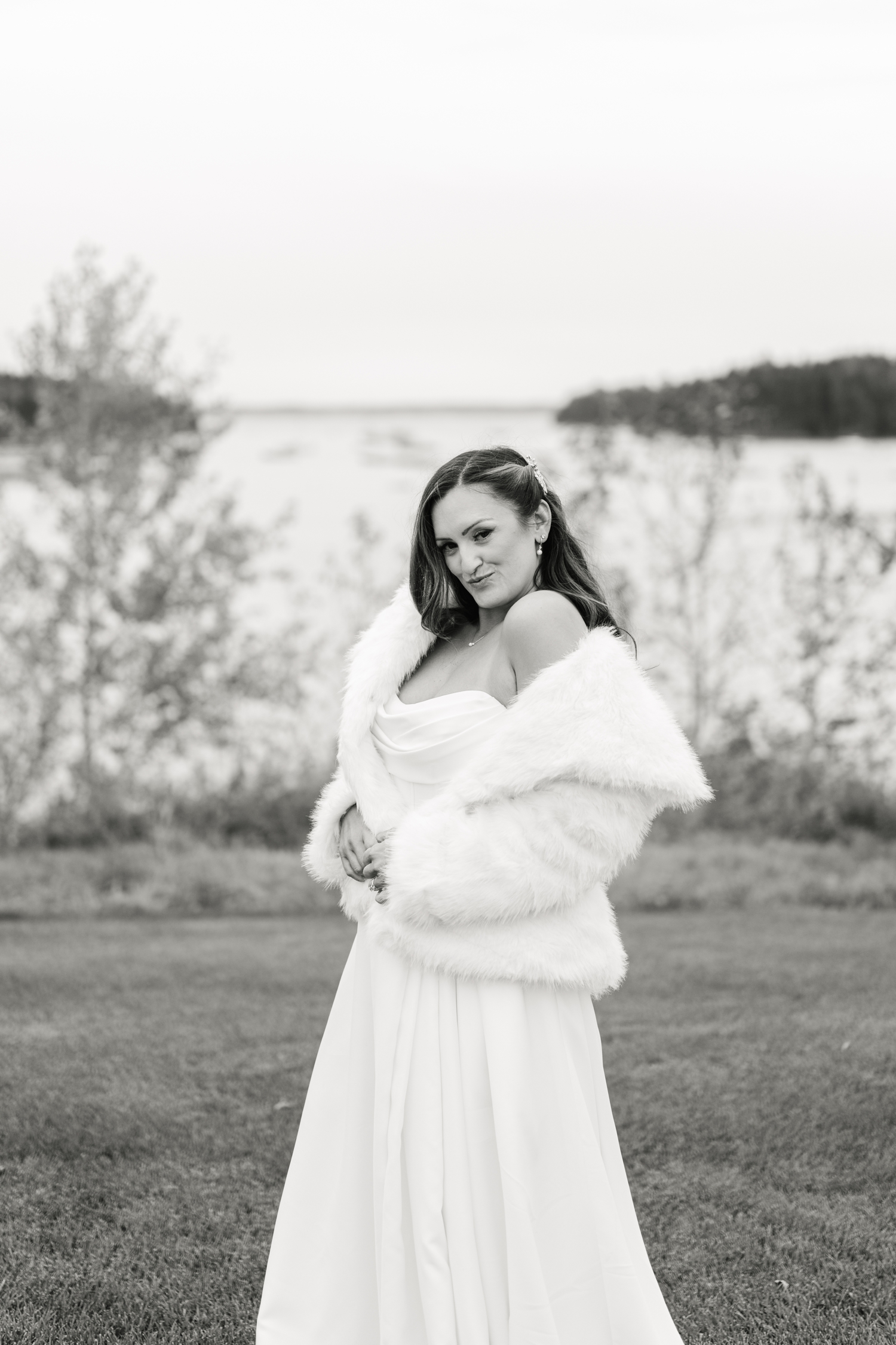 Bride wrapped in a white coat outside of Asticou Hotel Wedding.