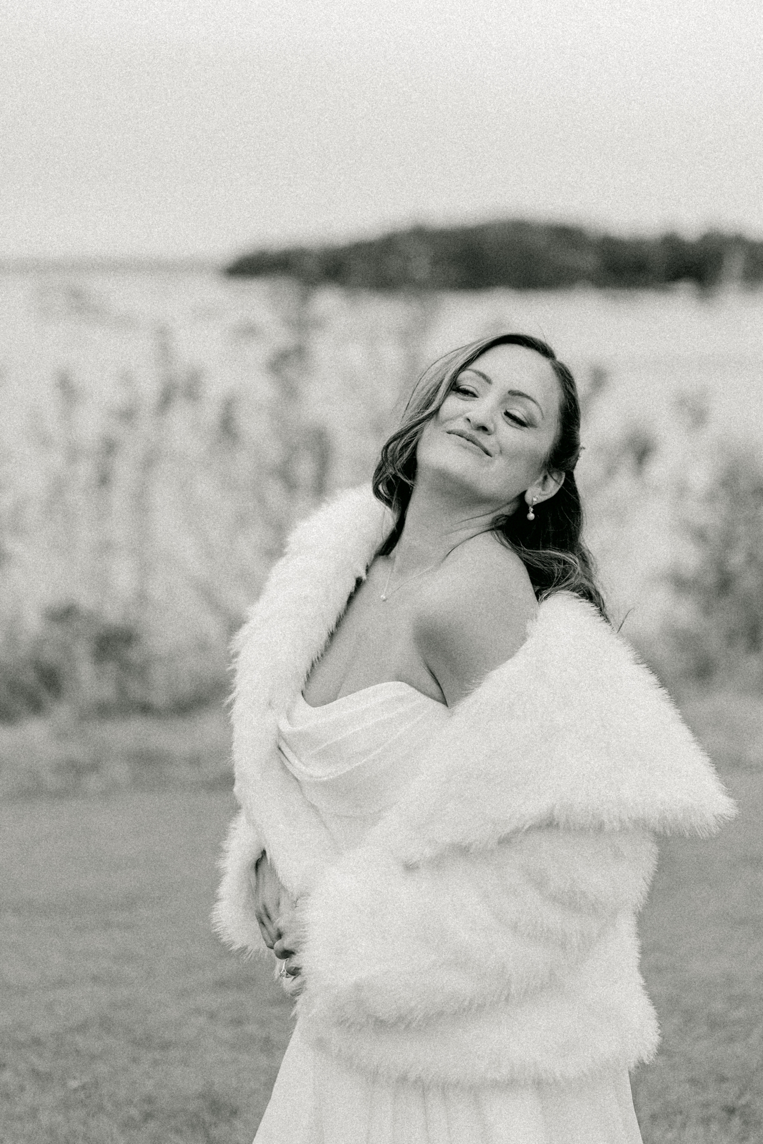 Bride wrapped in a white coat outside of Asticou Hotel Wedding.