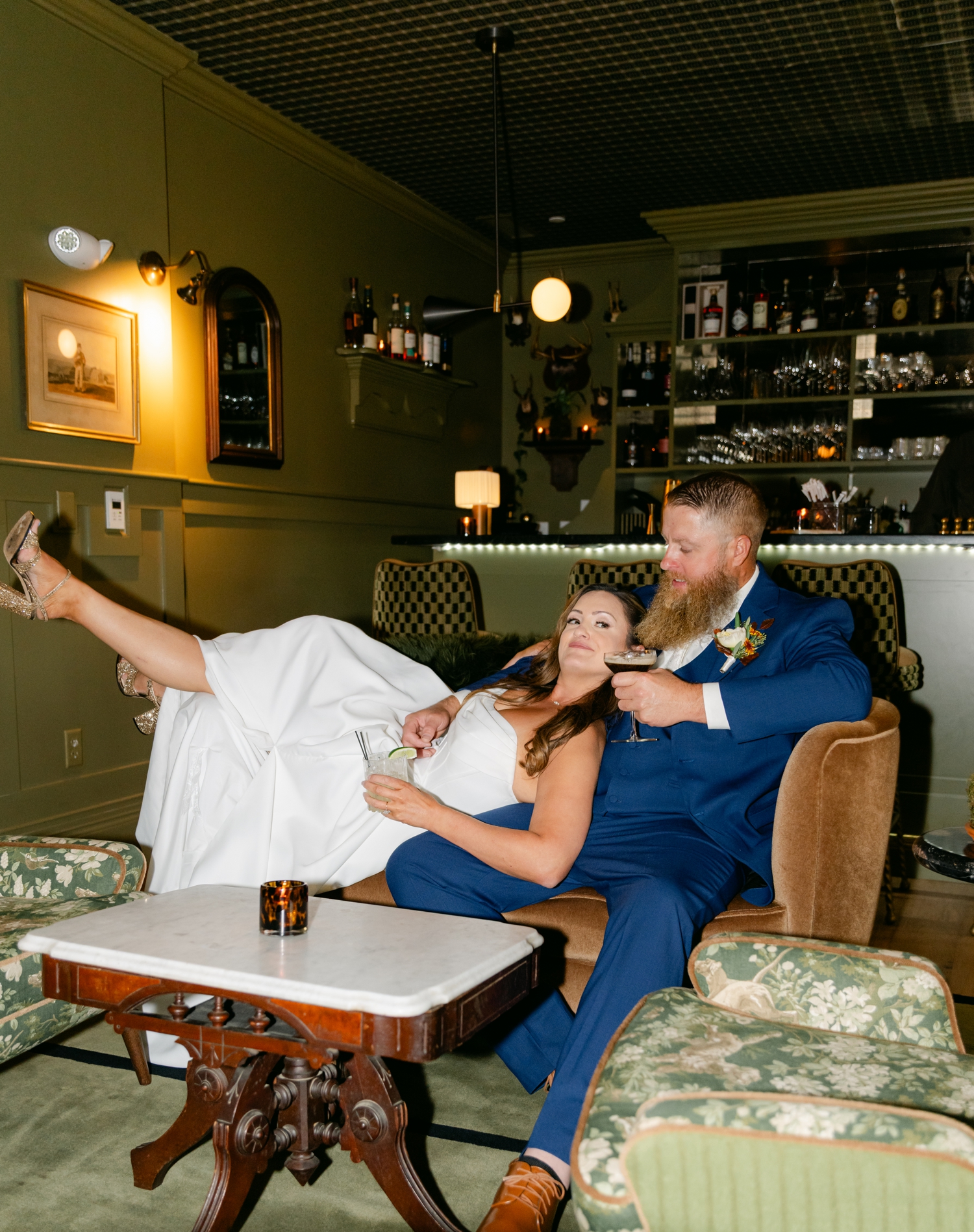 Bride and Groom celebrating inside the bar at the Asticou Hotel during their cozy fall micro-wedding.