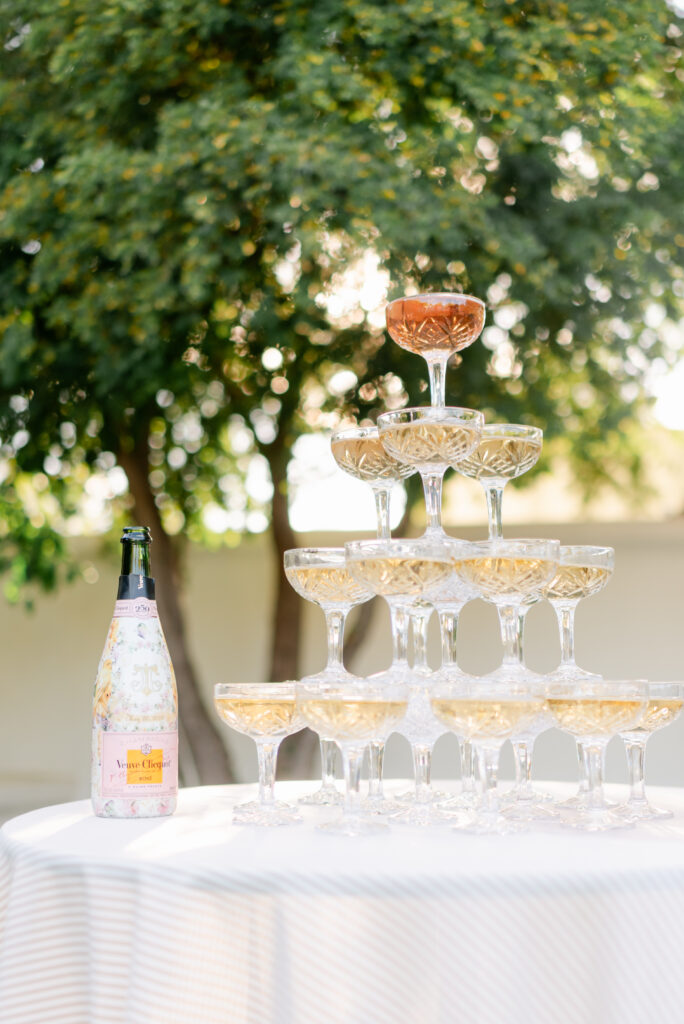 Champagne tower setup at El Chorro Wedding Venue in Paradise Valley, AZ as an elegant wedding cocktail hour idea