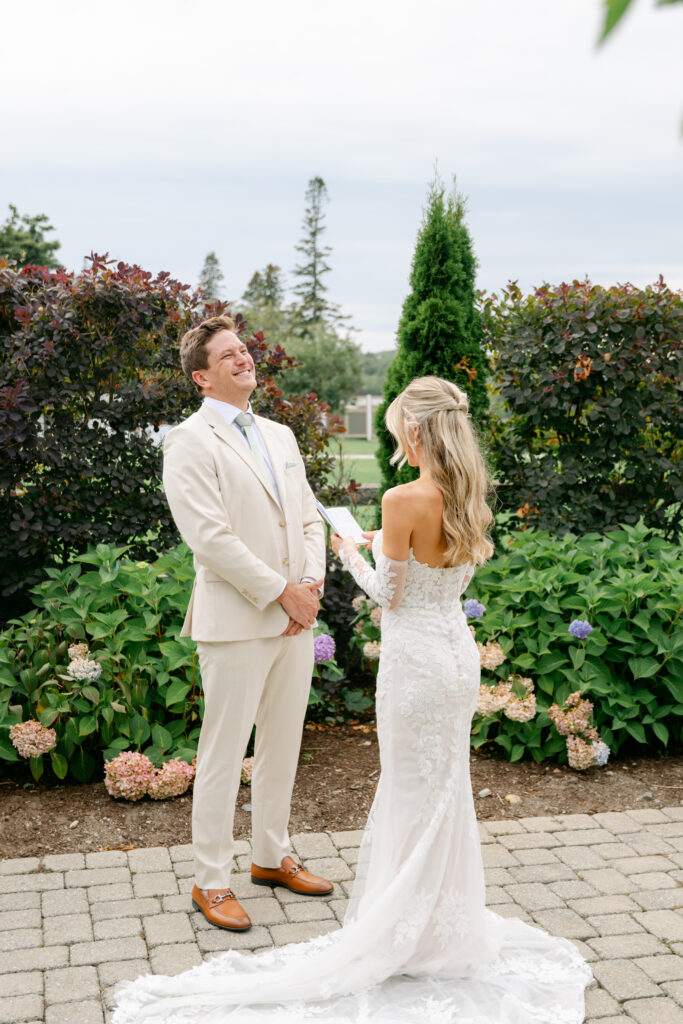 Madison and Eli share private vows before their ceremony at The Bar Harbor Club, sharing a quiet, intimate moment together on the Maine coast.